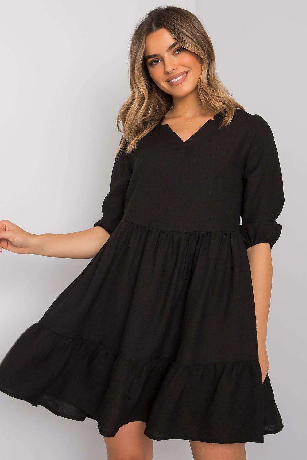 Black tiered daydress with V-neck, gathered waist and three-quarter sleeves