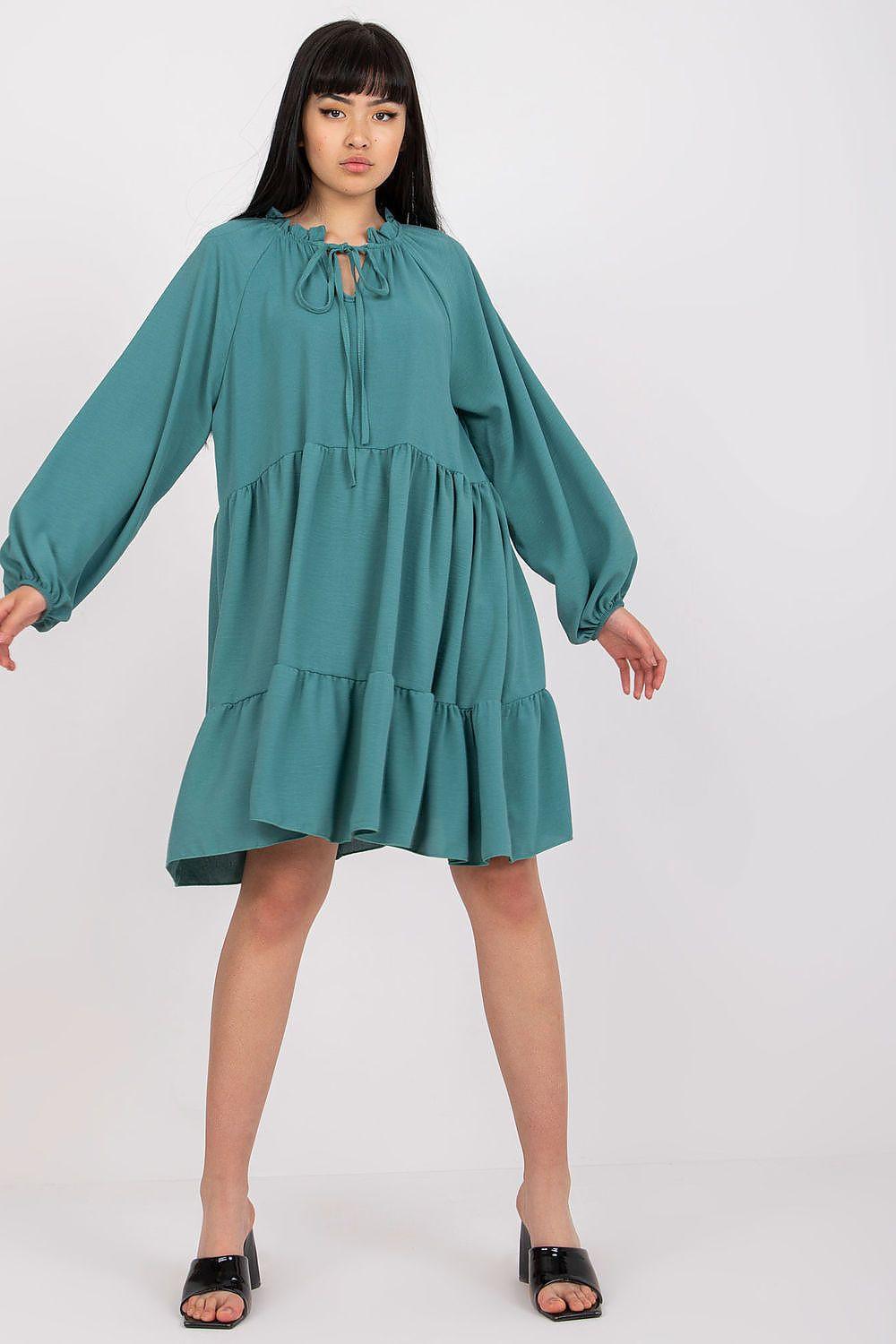 Teal tiered long-sleeve daydress with tie neckline and gathered waist