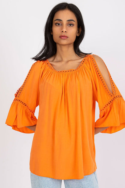 Orange blouse with 3/4 sleeves, ruched neckline, and cutout lace trim