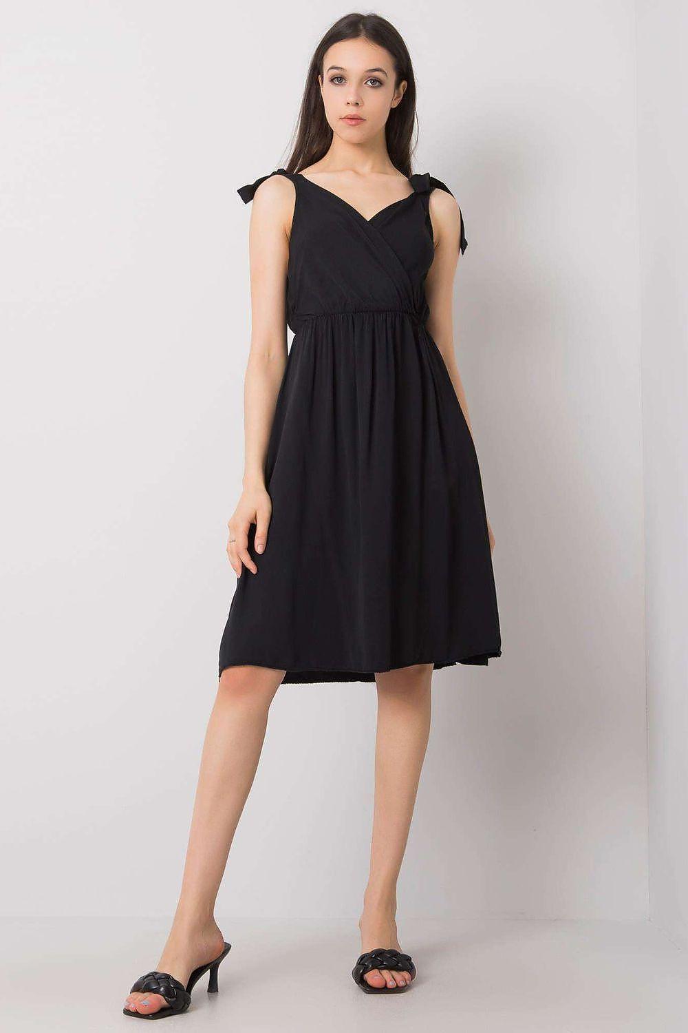 Black sleeveless day dress with cross-over bodice and gathered waist, knee-length