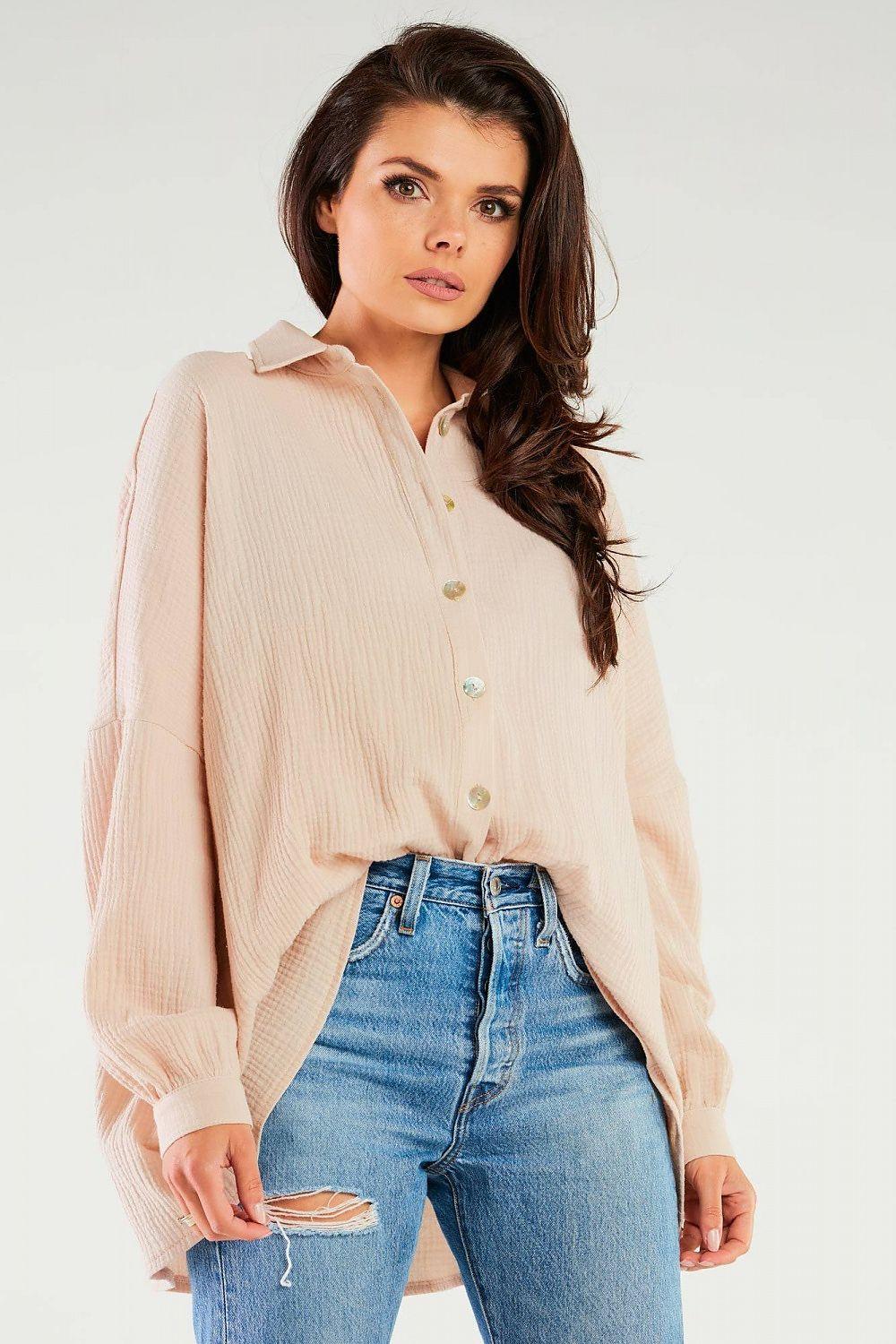 Beige long-sleeve shirt with collar and button front, gathered cuffs, textured fabric