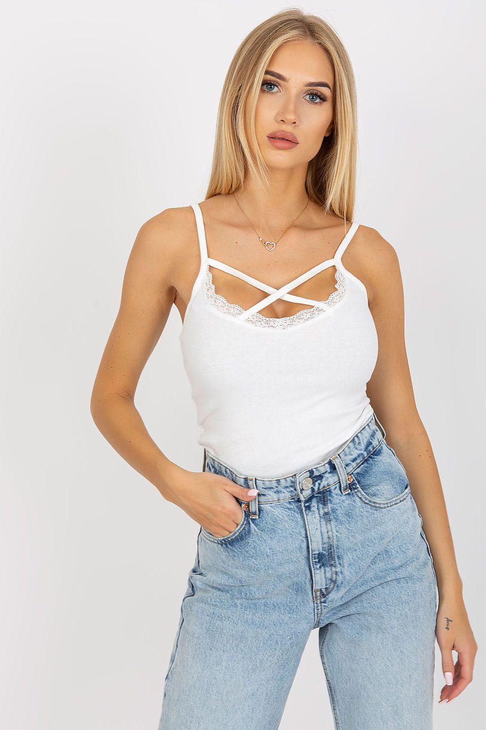White camisole top with lace trim and crisscross spaghetti straps
