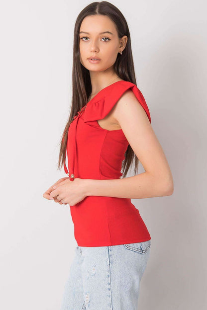 Red blouse with frill sleeves and lace-up neckline, side view