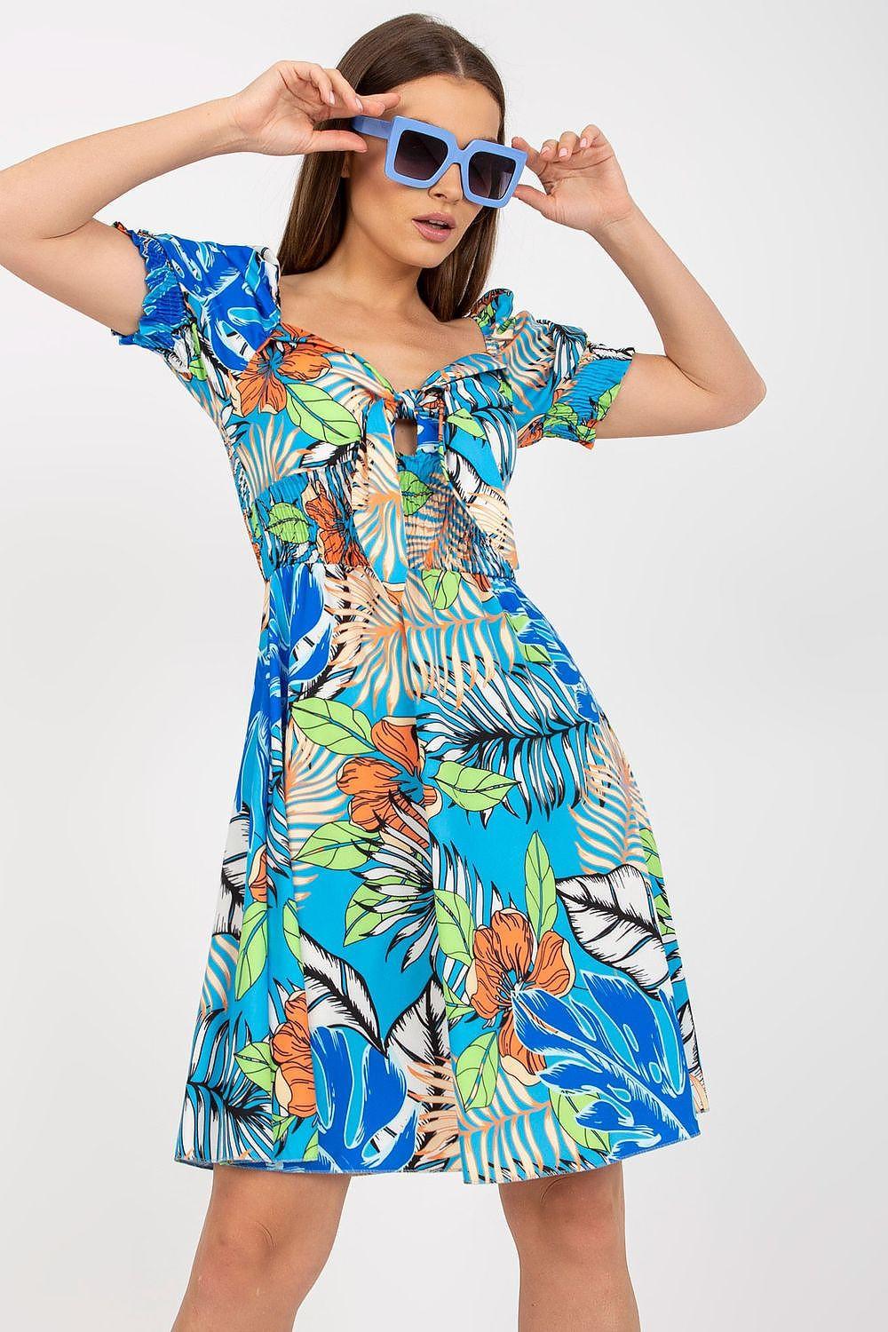 Blue tropical print day dress with puff sleeves, square neckline, A-line skirt