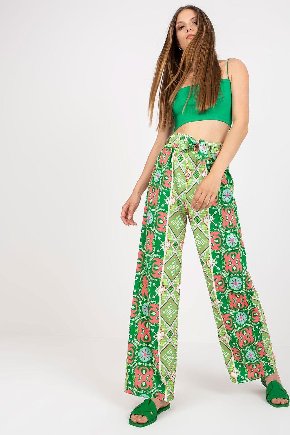 Green high-waist wide-leg trousers with red and pink floral print