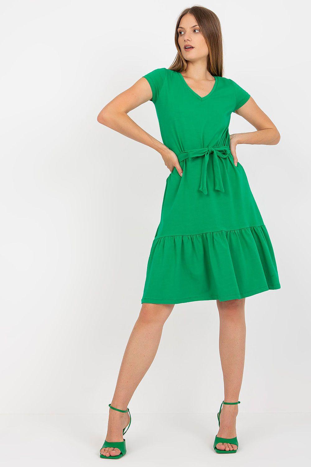 Green sleeveless day dress with V-neck, tie waist belt, and tiered skirt