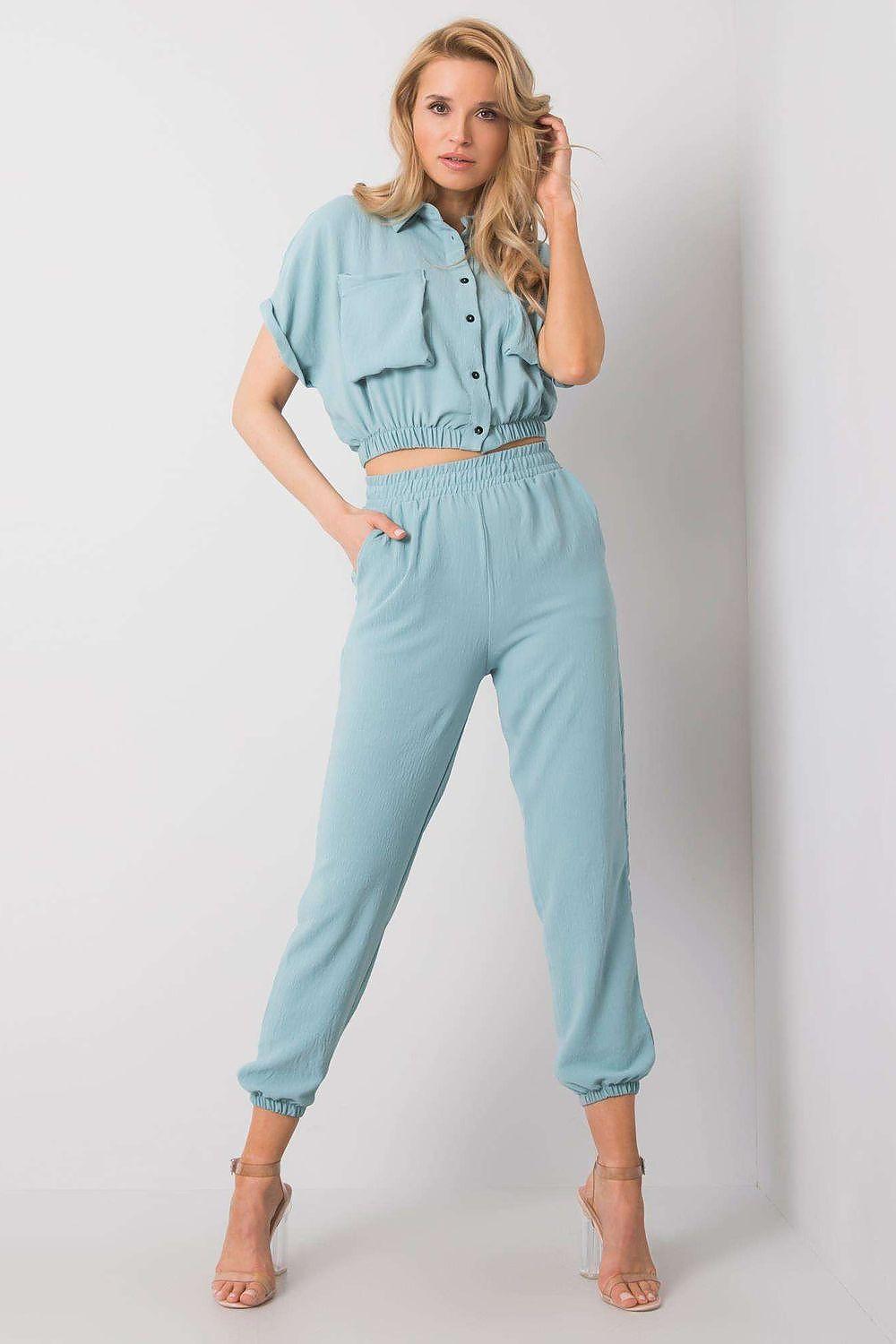 Women light blue trousers with elastic ankle cuffs and fitted waist