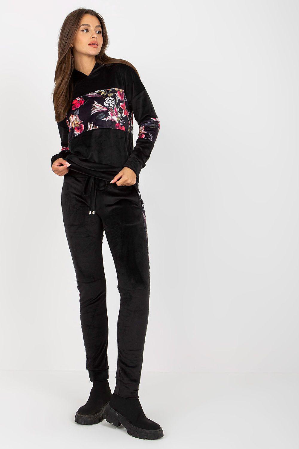 Black velour hoodie and pants set with floral accent front pouch and long sleeves