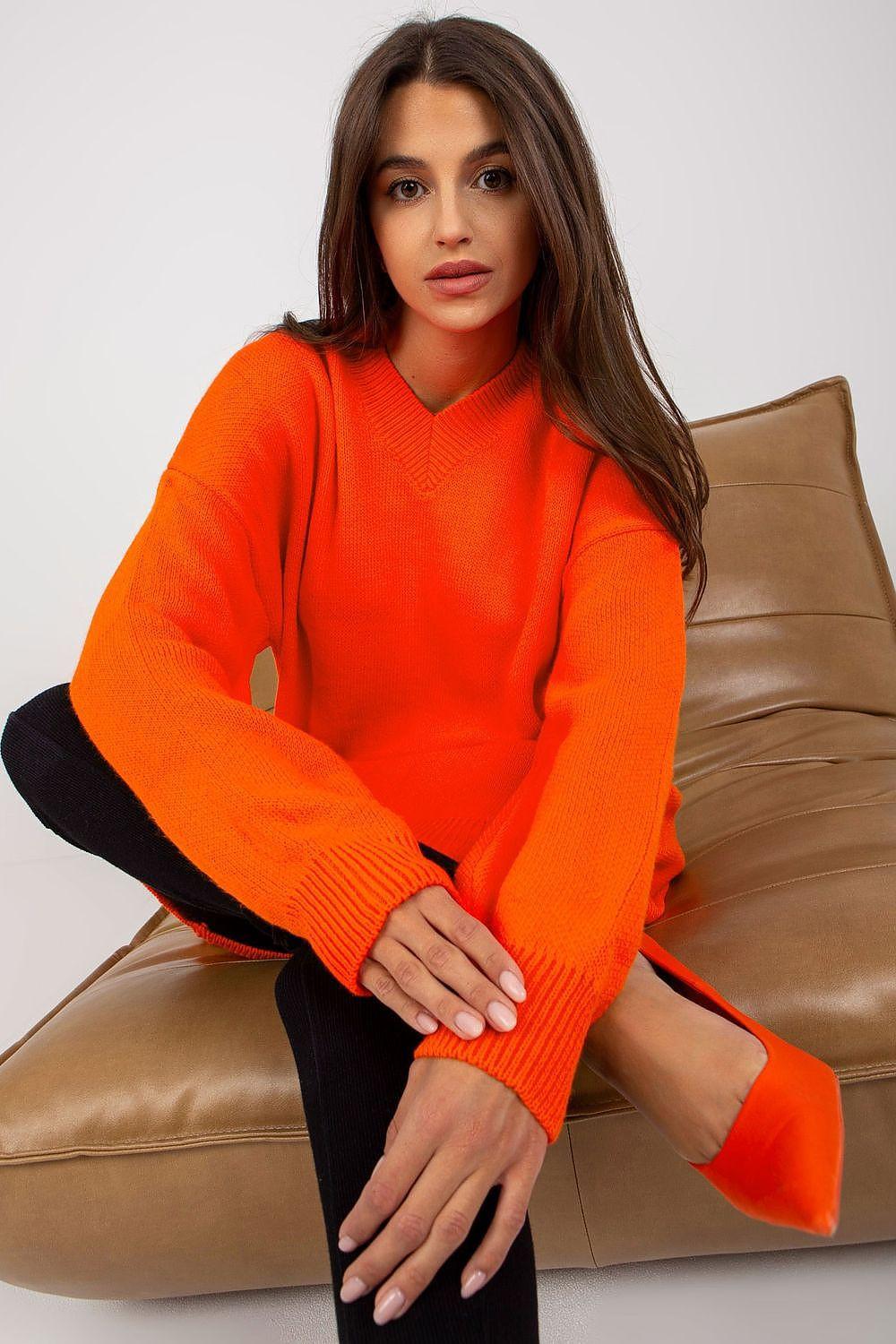Orange knit daydress with long sleeves and V-neck, mini length
