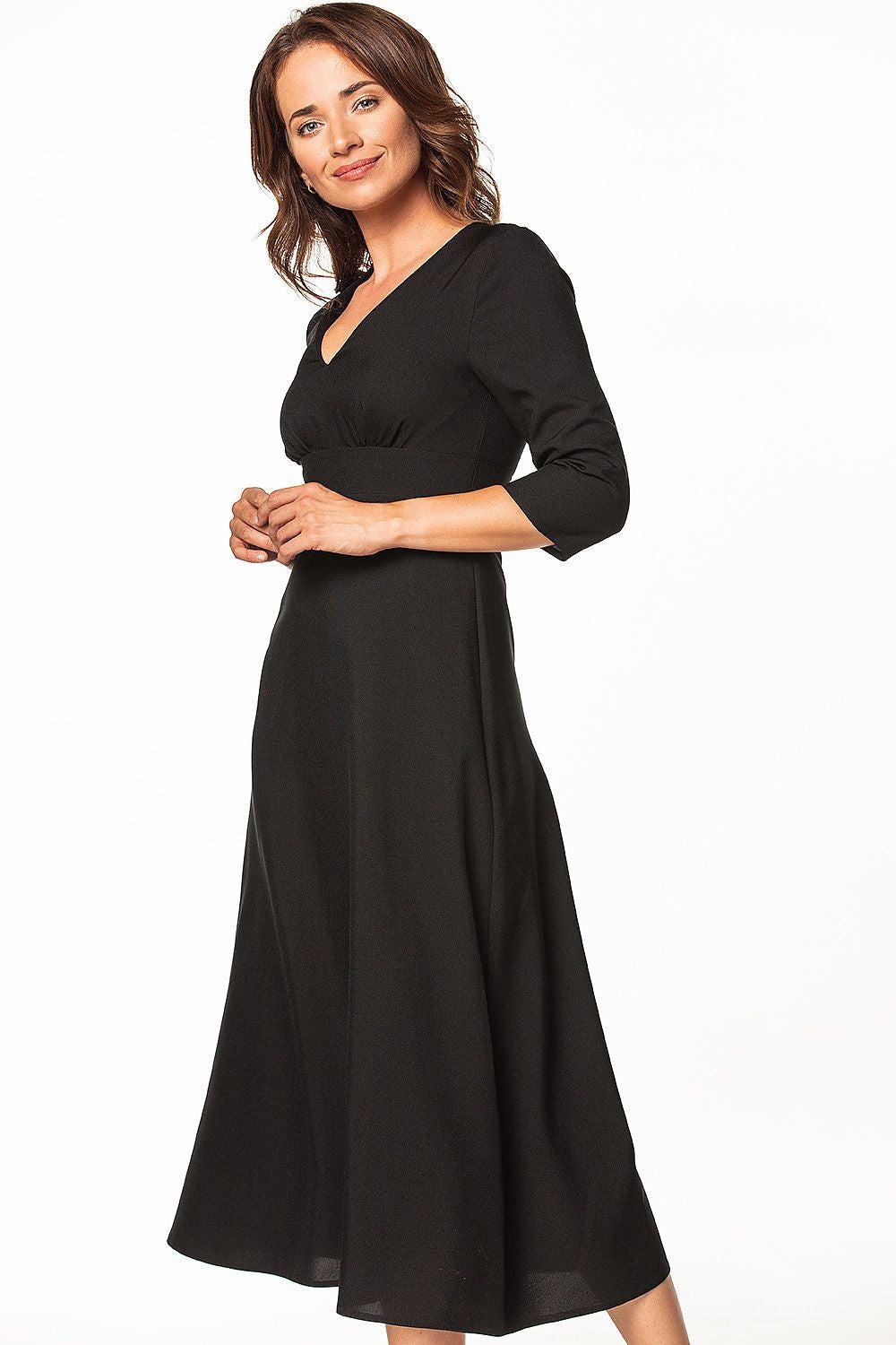 Black daydress with V-neck wrap design and 3/4 sleeves, midi length