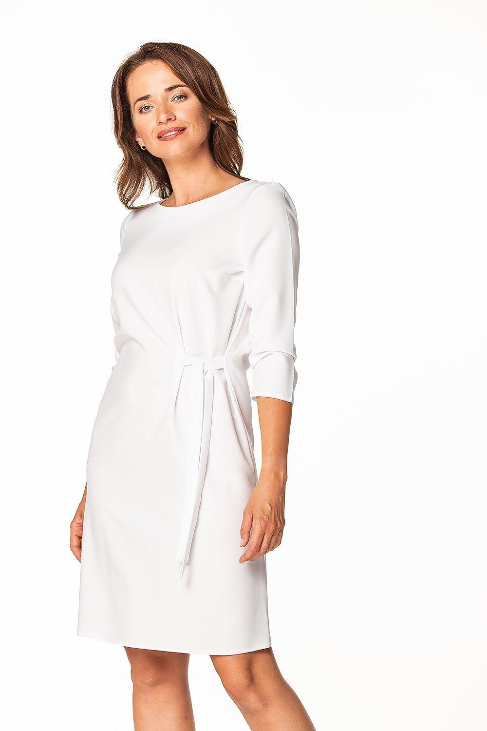 White daydress with 3/4 sleeves, round neck, and tie belt at the waist