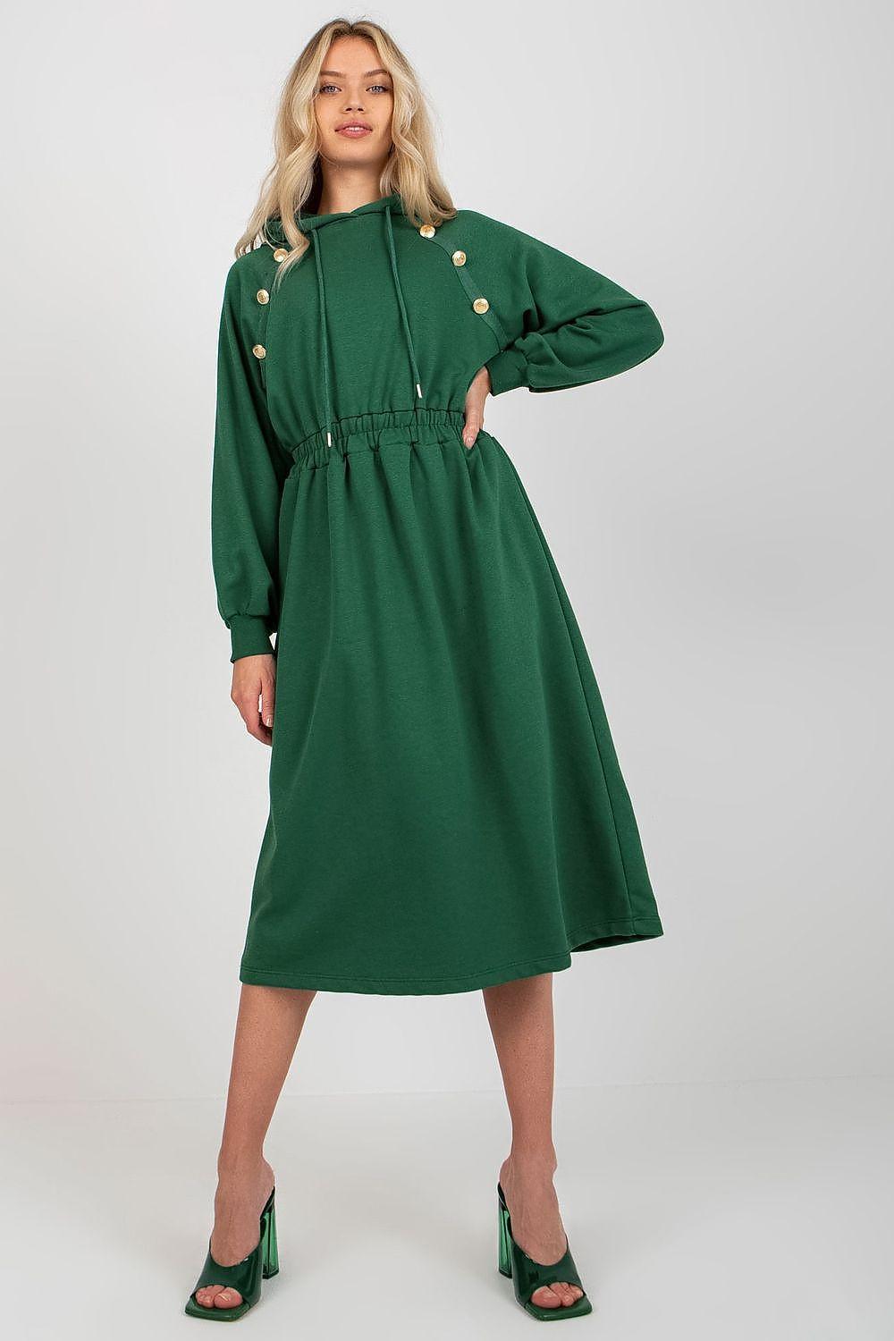 Green day dress with long sleeves, gold button accents, and gathered waist midi length