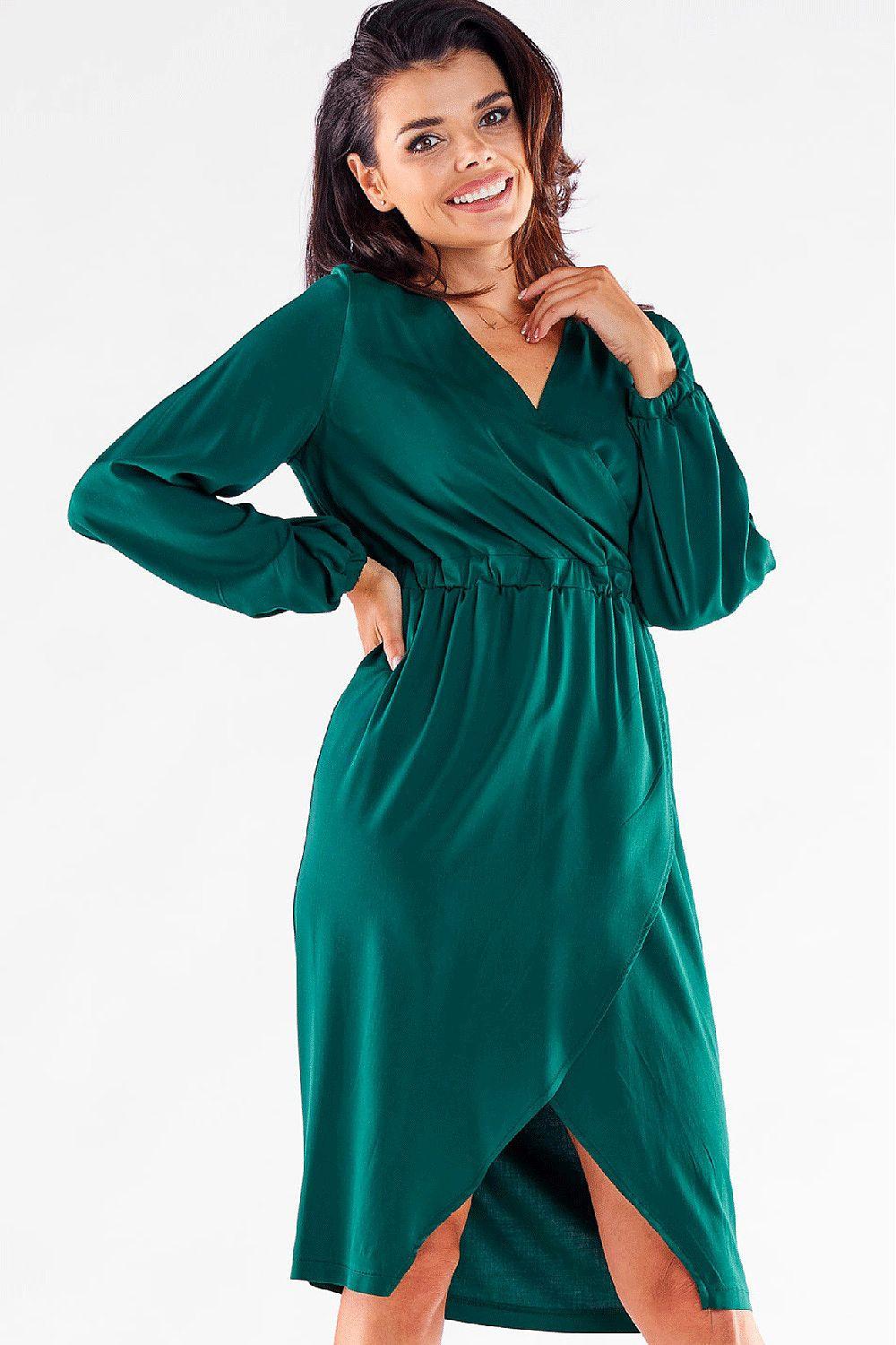 Green V-neck cocktail dress with long sleeves, ruched waist, and leg slit