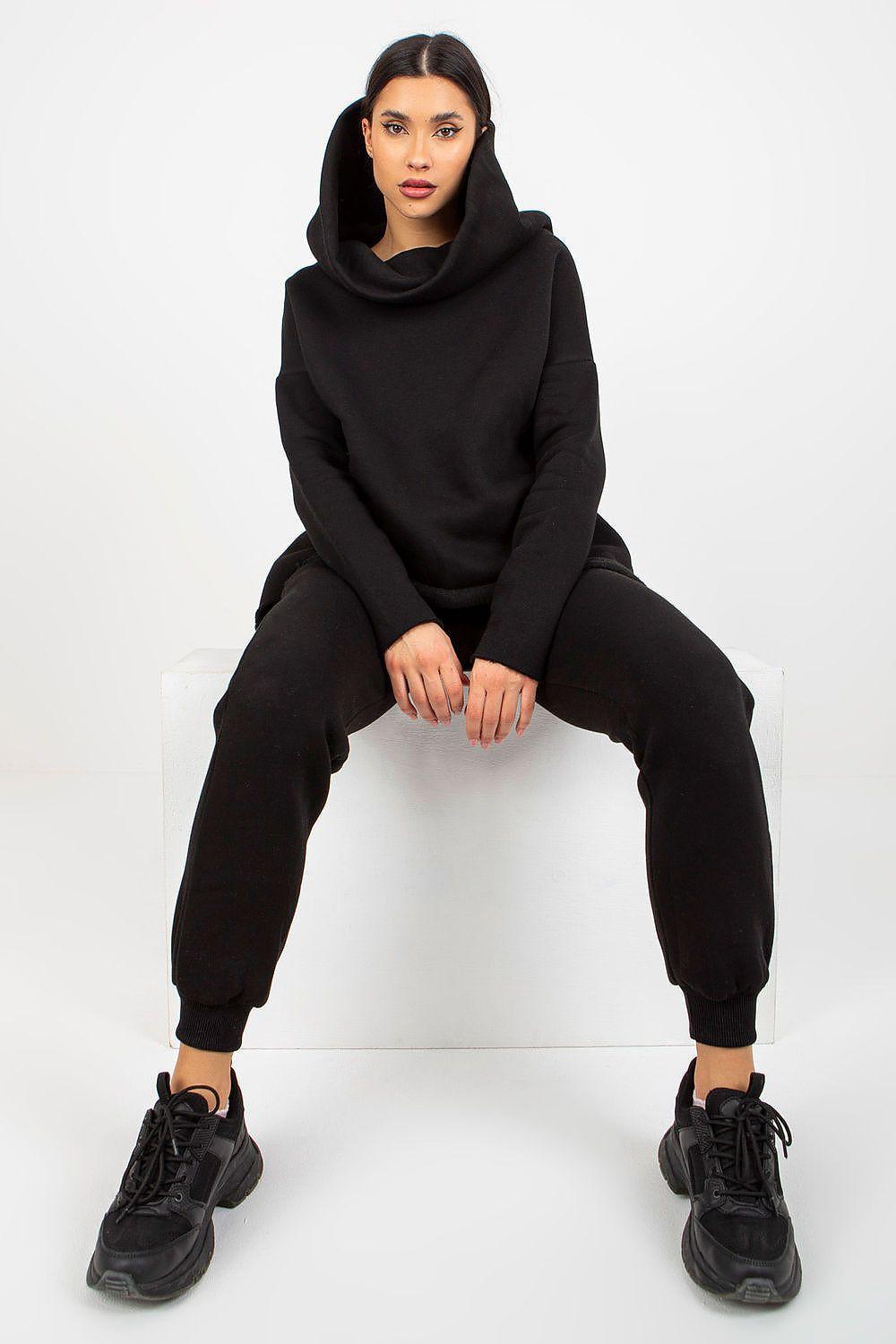 Women's black hoodie set with matching jogger pants, hood and cuffs visible.