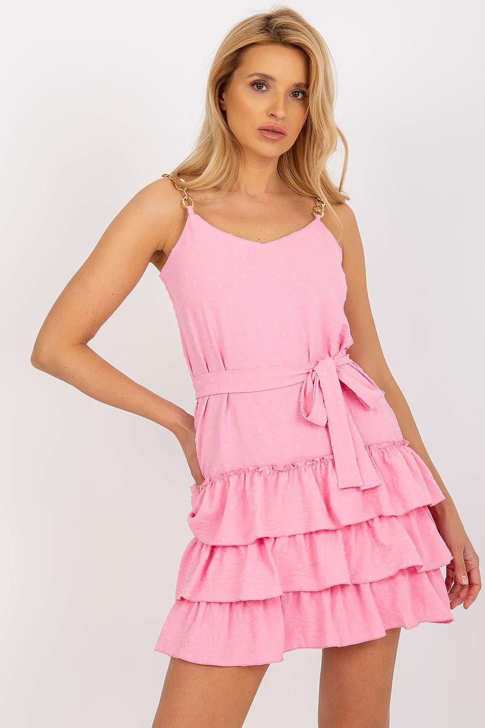 Pink sleeveless daydress with spaghetti straps, tiered ruffle skirt and tied waist