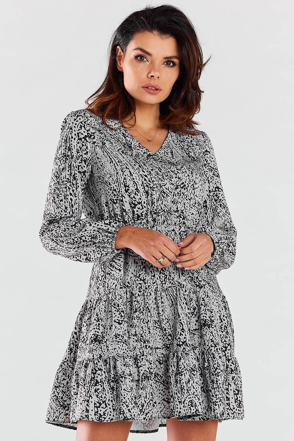 Printed short-sleeve daydress with V-neck, gathered waist, and tiered skirt in dark/white.