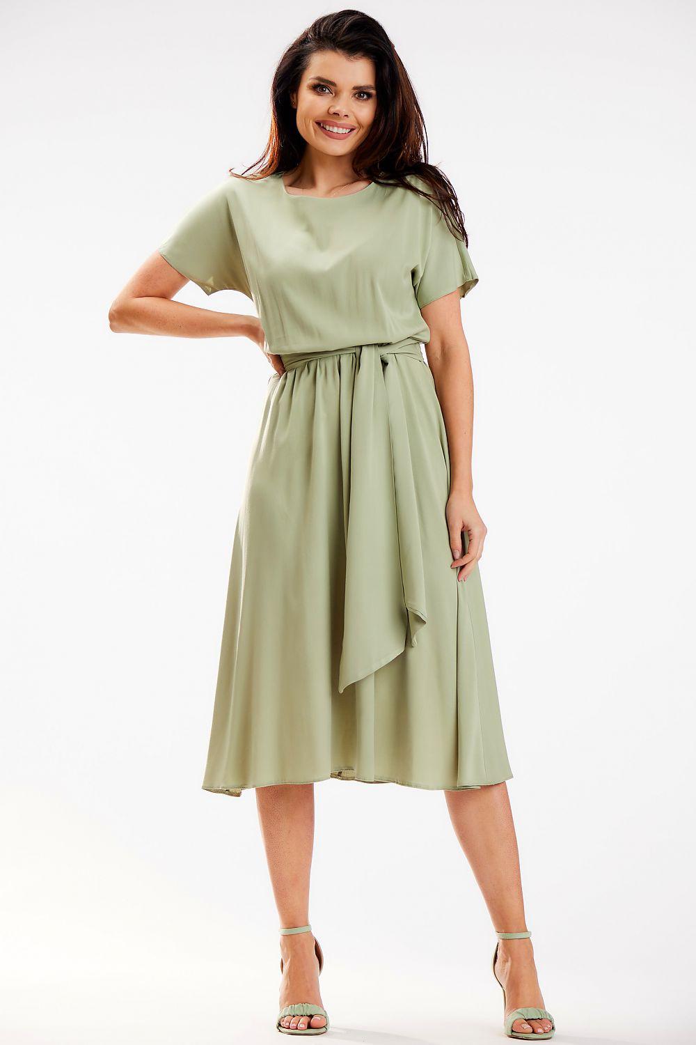 Green daydress, short sleeves, tie waist, draped midi skirt.