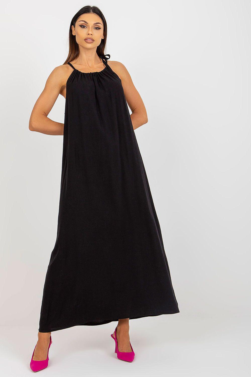 Black sleeveless halter daydress with gathered neckline and flowing maxi skirt