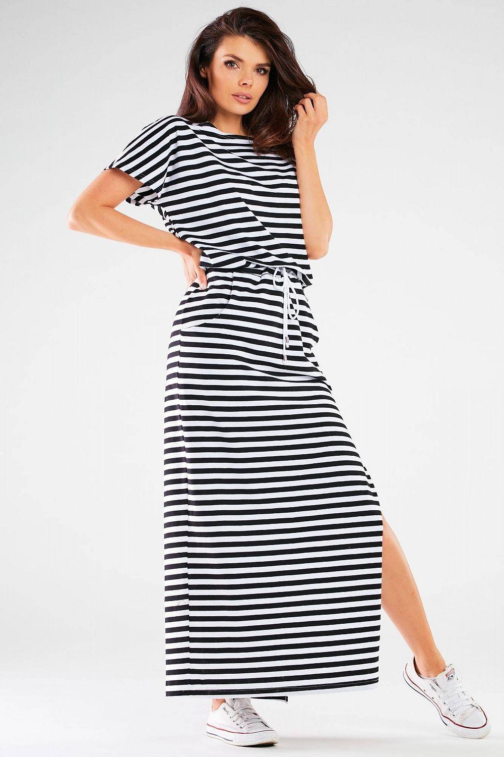 Black and white striped daydress with short sleeves and tied waist, side slit