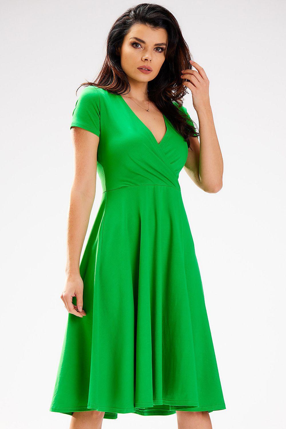 Green V-neck daydress with short sleeves, wrap bodice, and flared midi skirt.