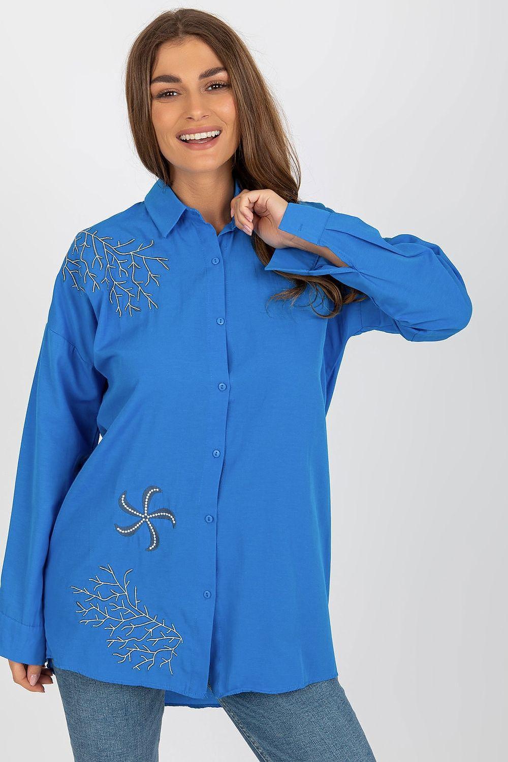 Blue long-sleeve button shirt with white floral embroidery on chest and hem