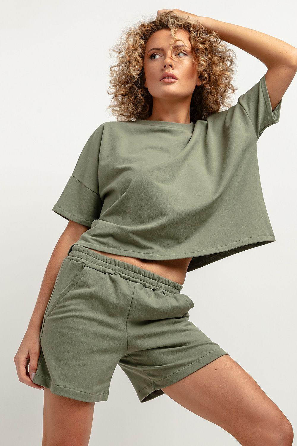 Women’s green shorts with elastic waist and cuffed hem, casual pull-on style.