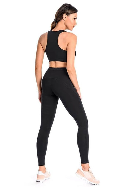 Black fitted long leggings with high-rise waistband, back view