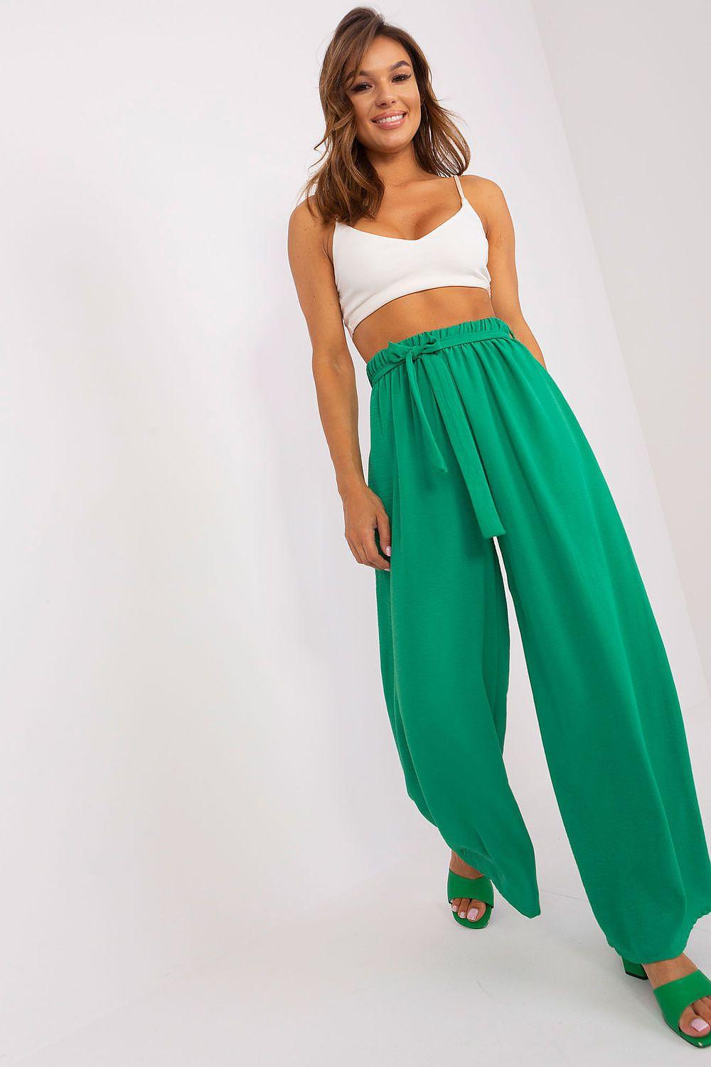 Green wide-leg trousers with elastic gathered waistband and long flowing legs