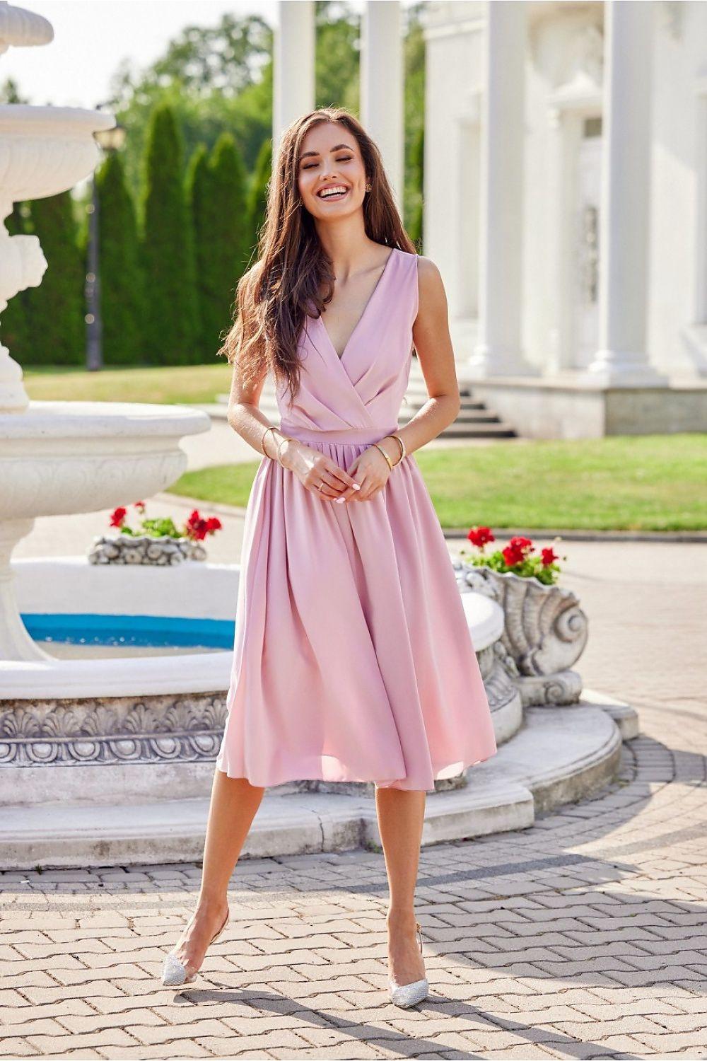 Pink V-neck sleeveless midi dress with wrap-style bodice, gathered waist, pleated skirt