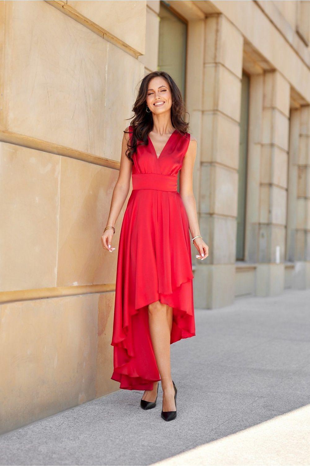 Red evening dress with V-neckline, sleeveless design, and flowing asymmetrical skirt hem